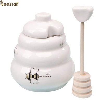 Porcelanowy garnek miodu i łyżka Ceramiczny biały garnek miodu z pokrywką