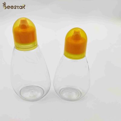 kupować 250 ml 350 ml 500 ml Słoik miodu i łyżka Plastikowe puste butelki miodu do przechowywania miodu produkcja online