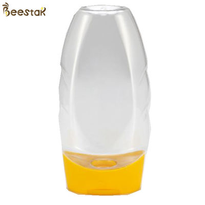 kupować Food Grade Plastik Cena fabryczna Specjalny plastikowy słoik miodu i łyżka 335 ml Pusta produkcja online