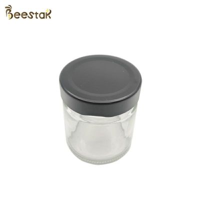 kupować 250 ml szklana butelka miodu i łyżka do pakowania miodu produkcja online