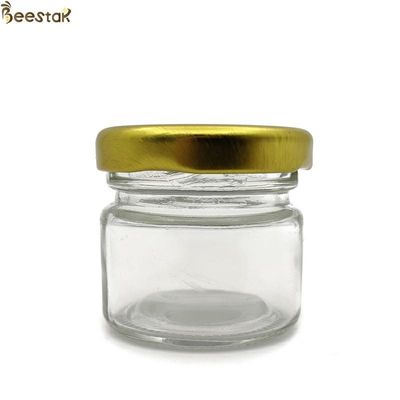 kupować 25 ml szklane słoiki z miodem luzem Puste szklane słoiki do przechowywania Szklane butelki z miodem produkcja online