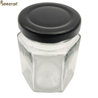 kupować 35ml Muti Prismatic Bottle 45ml 65ml 85ml Przezroczysty sześciokątny szklany słoik miodu produkcja online